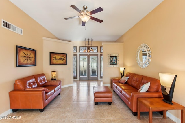 tiled living room featuring ceiling fan and french doors