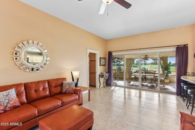 tiled living room featuring ceiling fan