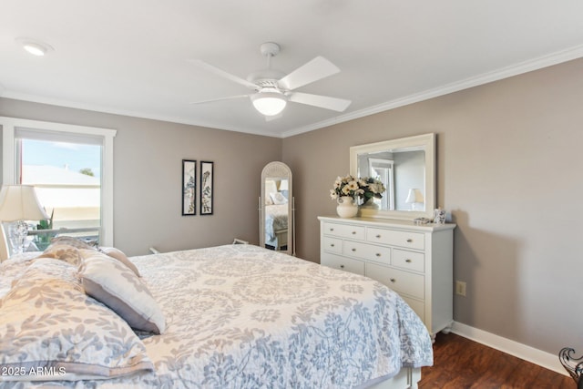 bedroom featuring dark hardwood / wood-style flooring, ceiling fan, and crown molding