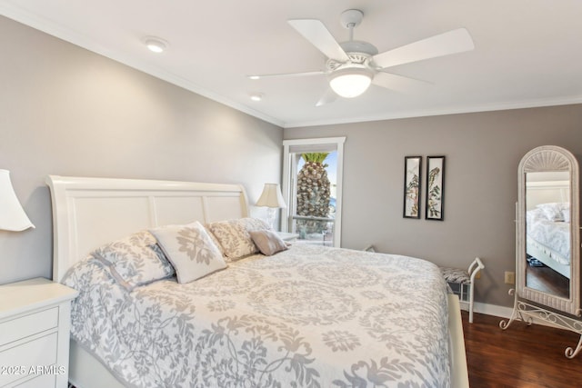 bedroom featuring ceiling fan, dark hardwood / wood-style flooring, and crown molding