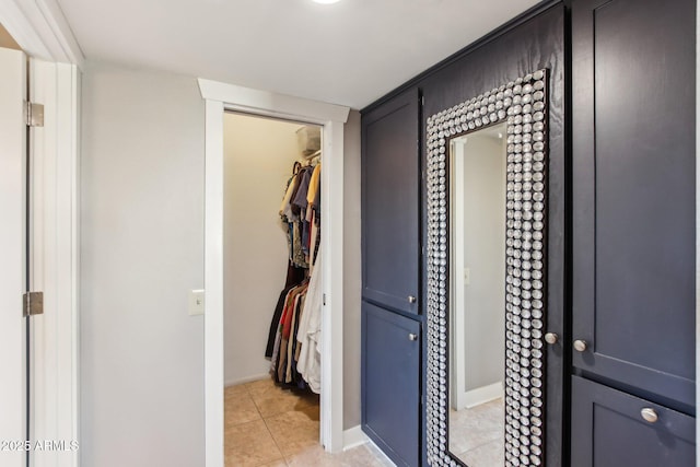 hallway with light tile patterned floors