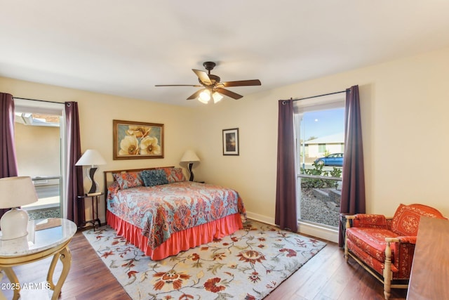 bedroom with hardwood / wood-style floors and ceiling fan