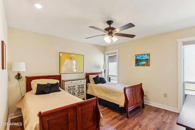 bedroom with ceiling fan and dark wood-type flooring