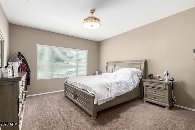 bedroom featuring light colored carpet and baseboards