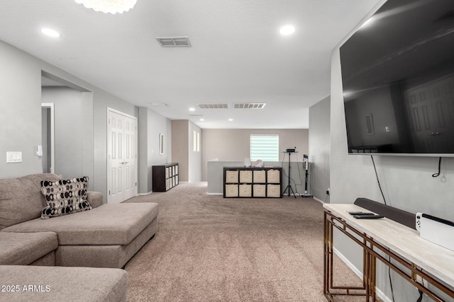 living room featuring visible vents, recessed lighting, and carpet