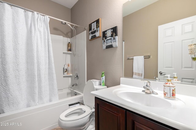 bathroom featuring toilet, vanity, and shower / bath combo