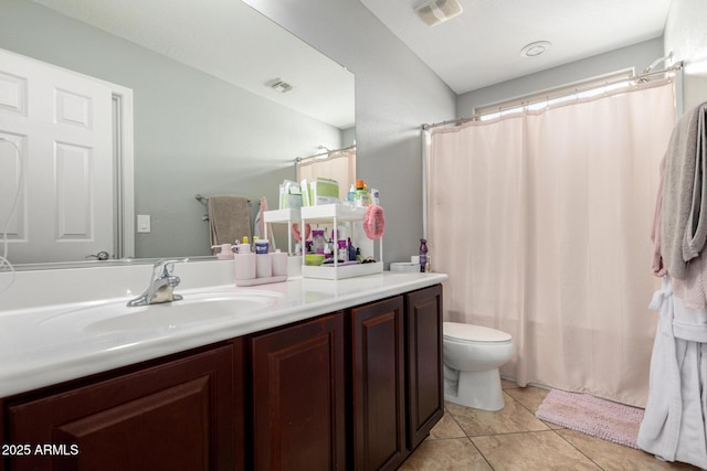 full bath with visible vents, toilet, a shower with shower curtain, tile patterned floors, and vanity