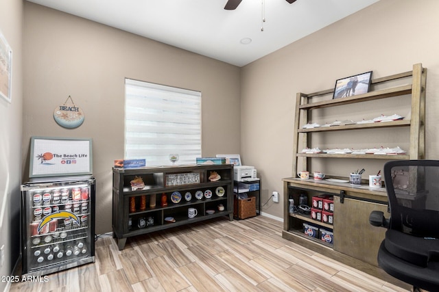 office space with ceiling fan and wood finished floors