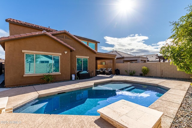 view of pool featuring a fenced in pool, a fenced backyard, and a patio area