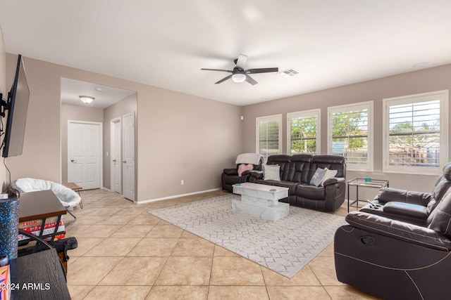 living room with ceiling fan and light tile patterned floors