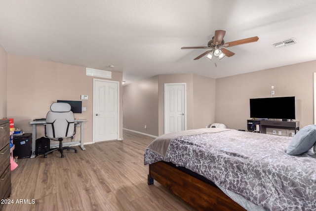 bedroom featuring light wood-type flooring and ceiling fan