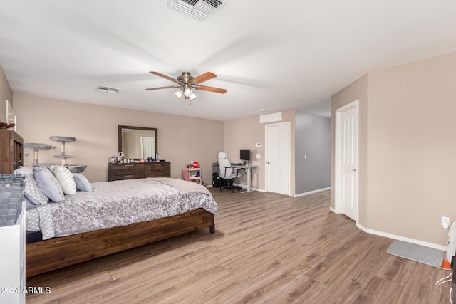 bedroom featuring ceiling fan and light hardwood / wood-style floors