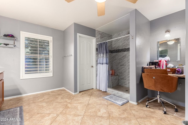 bathroom with a shower with shower curtain, vanity, ceiling fan, and tile patterned flooring