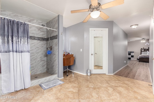 bathroom featuring hardwood / wood-style flooring, a shower with curtain, and ceiling fan