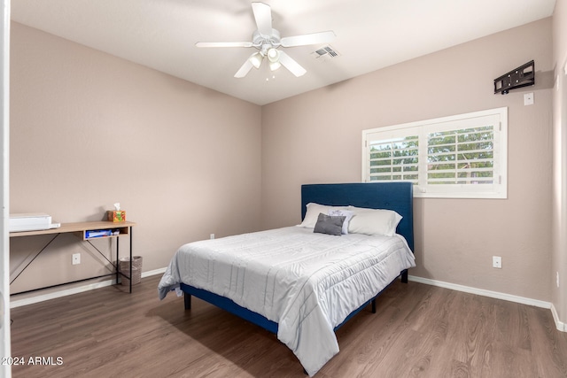 bedroom with hardwood / wood-style flooring and ceiling fan