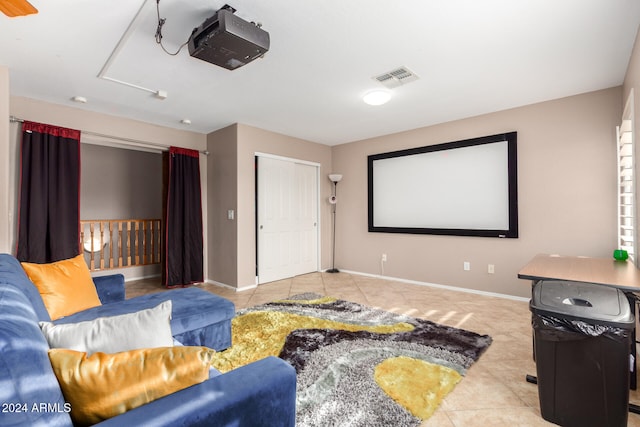 home theater room featuring light tile patterned floors