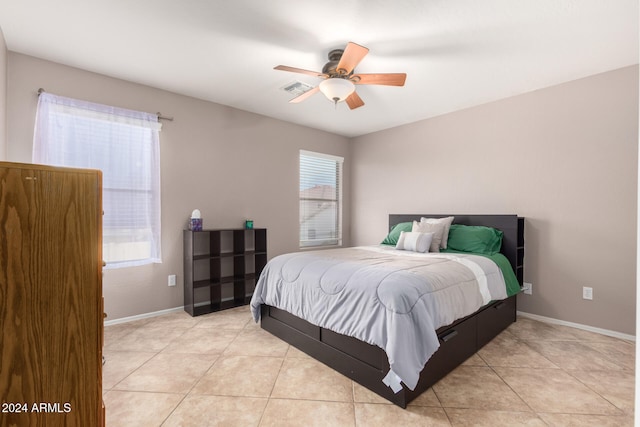 bedroom with light tile patterned floors and ceiling fan