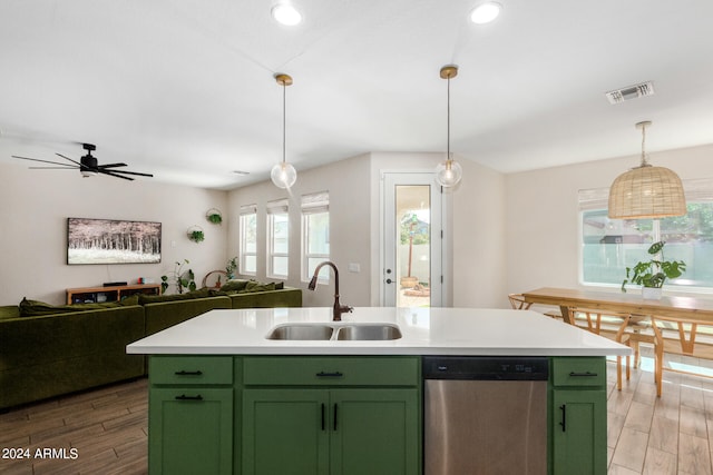 kitchen with an island with sink, light hardwood / wood-style floors, sink, and stainless steel dishwasher