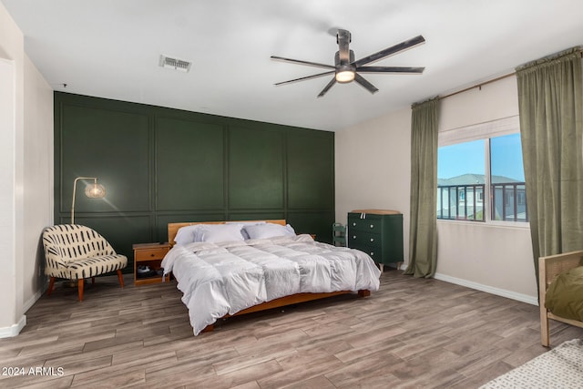 bedroom featuring ceiling fan and hardwood / wood-style floors