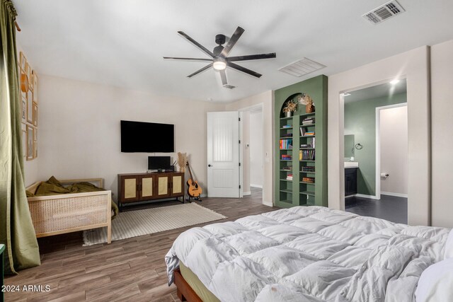 bedroom with ceiling fan, hardwood / wood-style flooring, and ensuite bathroom