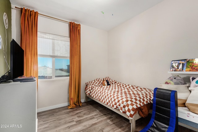 bedroom with light wood-type flooring