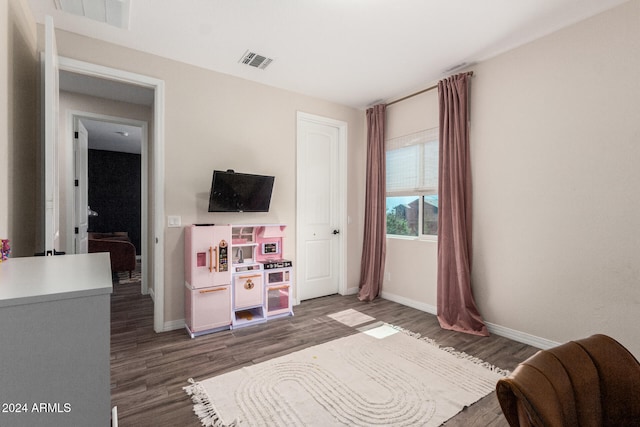 bedroom featuring dark wood-type flooring