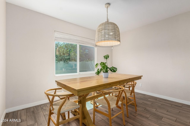 dining room with dark wood-type flooring