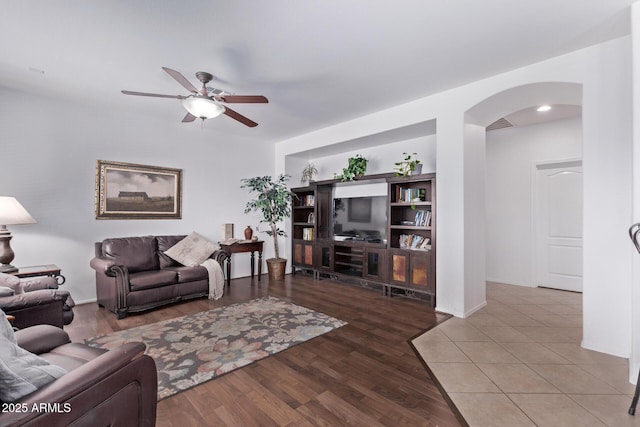 1405 E Aloe Dr, Chandler, AZ 85286 - living room with arched walkways, a ceiling fan, wood finished floors, and baseboards