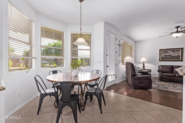 1405 E Aloe Dr, Chandler, AZ 85286 - dining area featuring light tile patterned floors, a ceiling fan, and baseboards