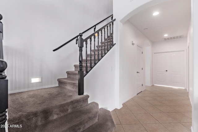 1405 E Aloe Dr, Chandler, AZ 85286 - stairway featuring arched walkways, tile patterned flooring, recessed lighting, and baseboards