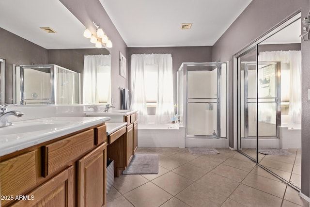1405 E Aloe Dr, Chandler, AZ 85286 - bathroom with a shower stall, double vanity, a garden tub, and tile patterned flooring