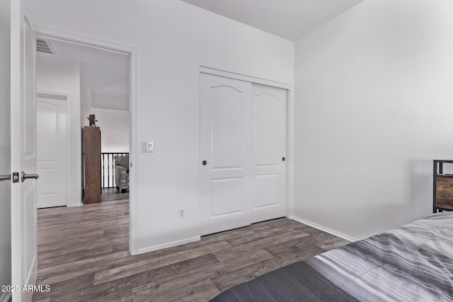 1405 E Aloe Dr, Chandler, AZ 85286 - unfurnished bedroom with wood finished floors, a closet, and baseboards