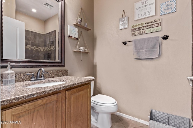 1405 E Aloe Dr, Chandler, AZ 85286 - bathroom with vanity, toilet, tile patterned floors, tiled shower, and baseboards