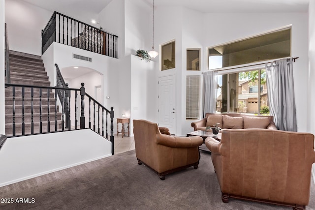 1405 E Aloe Dr, Chandler, AZ 85286 - living room featuring stairway, arched walkways, carpet floors, and high vaulted ceiling