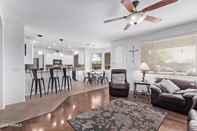1405 E Aloe Dr, Chandler, AZ 85286 - living room with ceiling fan, recessed lighting, light wood-type flooring, and baseboards