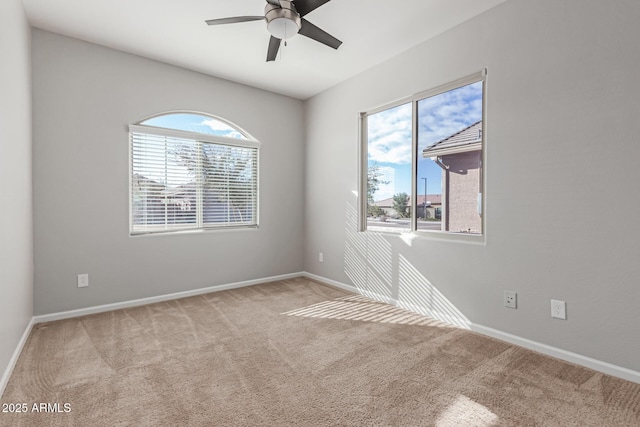 unfurnished room with light carpet and ceiling fan