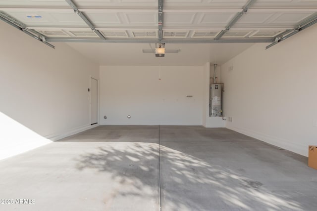 garage featuring a garage door opener and water heater