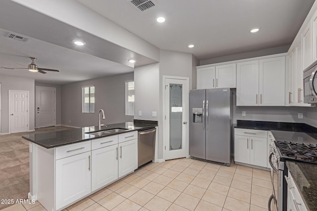 kitchen featuring white cabinets and appliances with stainless steel finishes