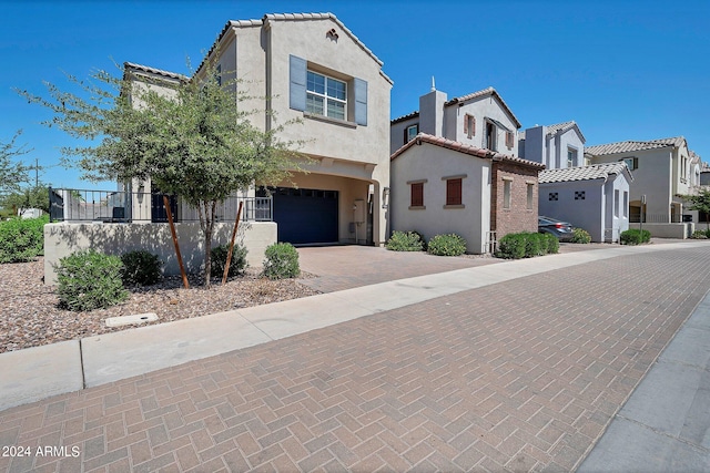 mediterranean / spanish house featuring a garage