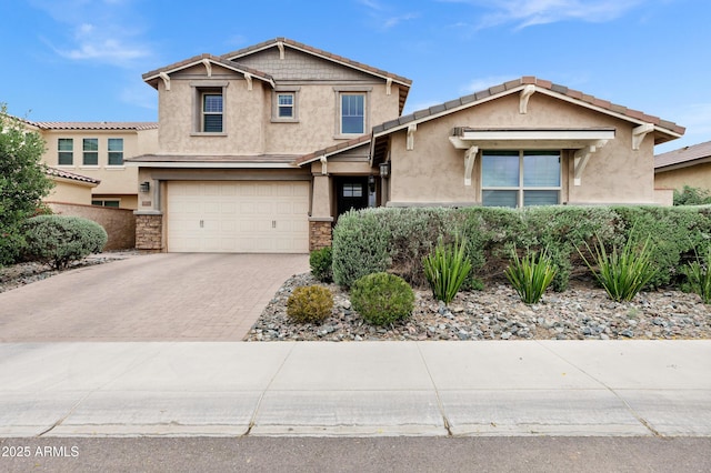 5223 S Axiom, Mesa, AZ 85212 - view of front of property with stucco siding, driveway, a garage, and stone siding