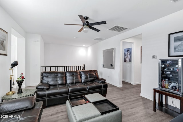 5223 S Axiom, Mesa, AZ 85212 - living area featuring a ceiling fan, baseboards, and wood finished floors
