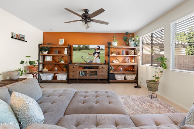 tiled living room with ceiling fan