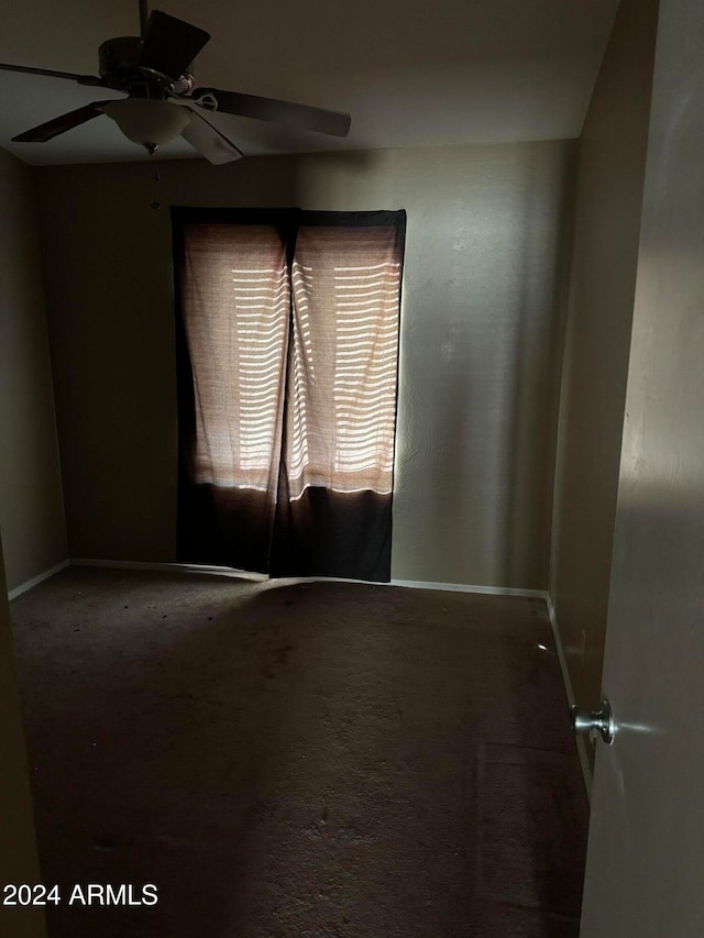 carpeted empty room with ceiling fan