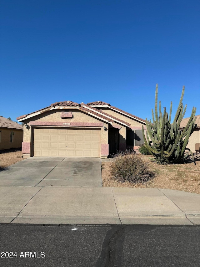 single story home with a garage