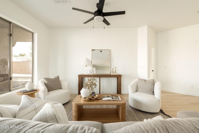 3047 S Chatsworth, Mesa, AZ 85212 - living area featuring wood finished floors, ceiling fan, and baseboards