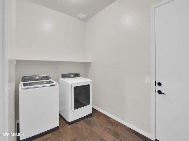 clothes washing area featuring washer and clothes dryer