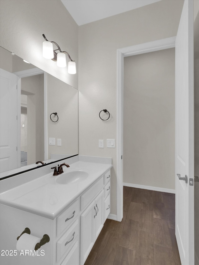 bathroom with vanity and hardwood / wood-style flooring