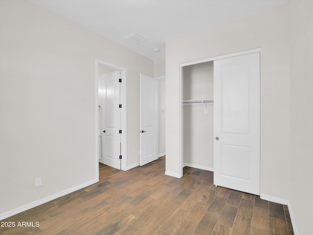 unfurnished bedroom with a closet