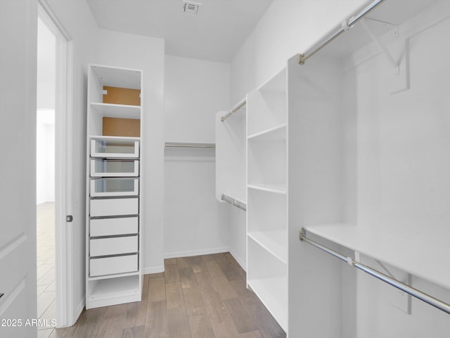 spacious closet with wood-type flooring