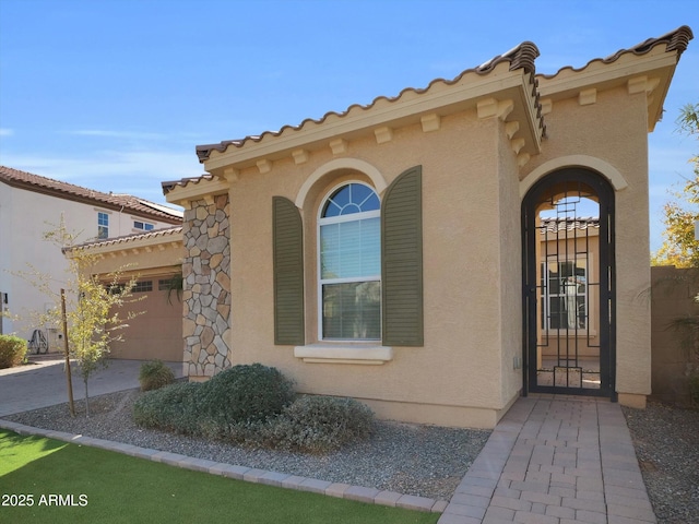 entrance to property featuring a garage